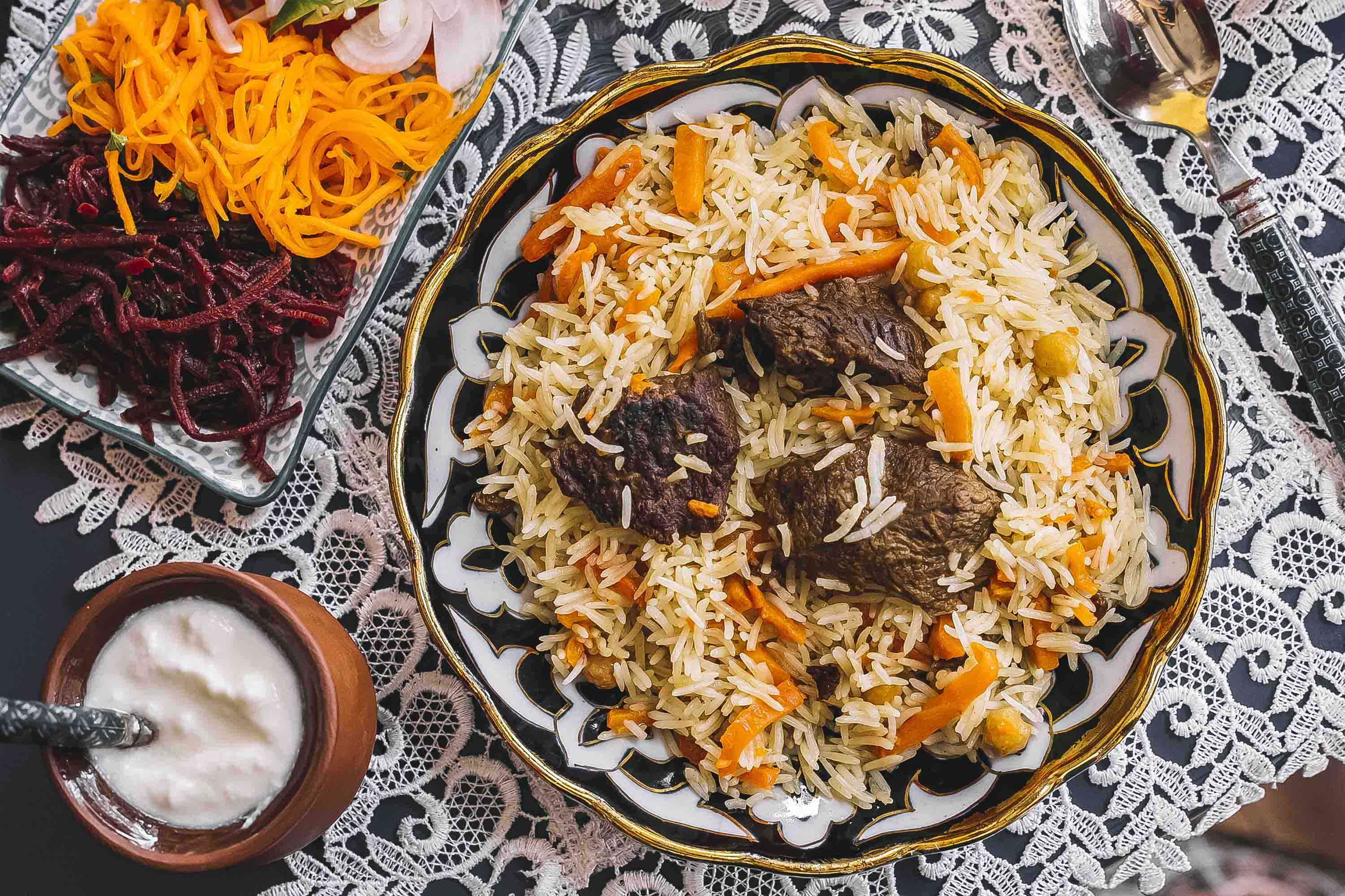 Authentic Lucknowi biryani served with aromatic rice, tender meat, and traditional spices on a plate.
